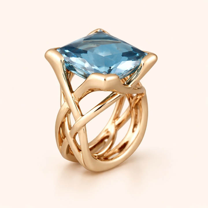 Elegante roségouden ring met blauwe zirkonia
