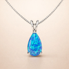 Zachte druppelketting van wit goud met opaal accent