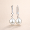 Elegante parel oorbellen met zirkonia in wit goud