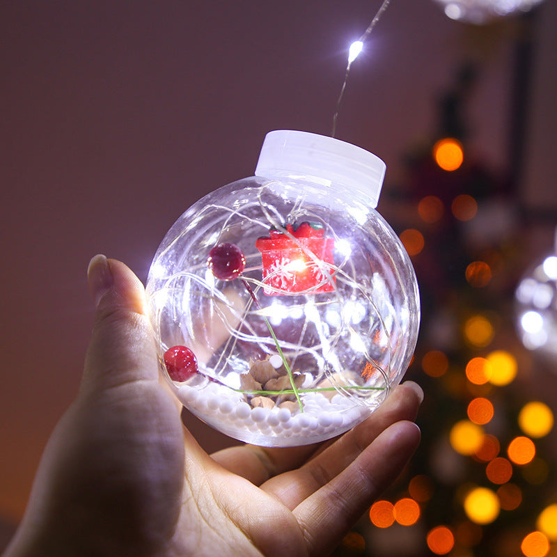 Lichtgordijn met kerstballen en kerstfiguren