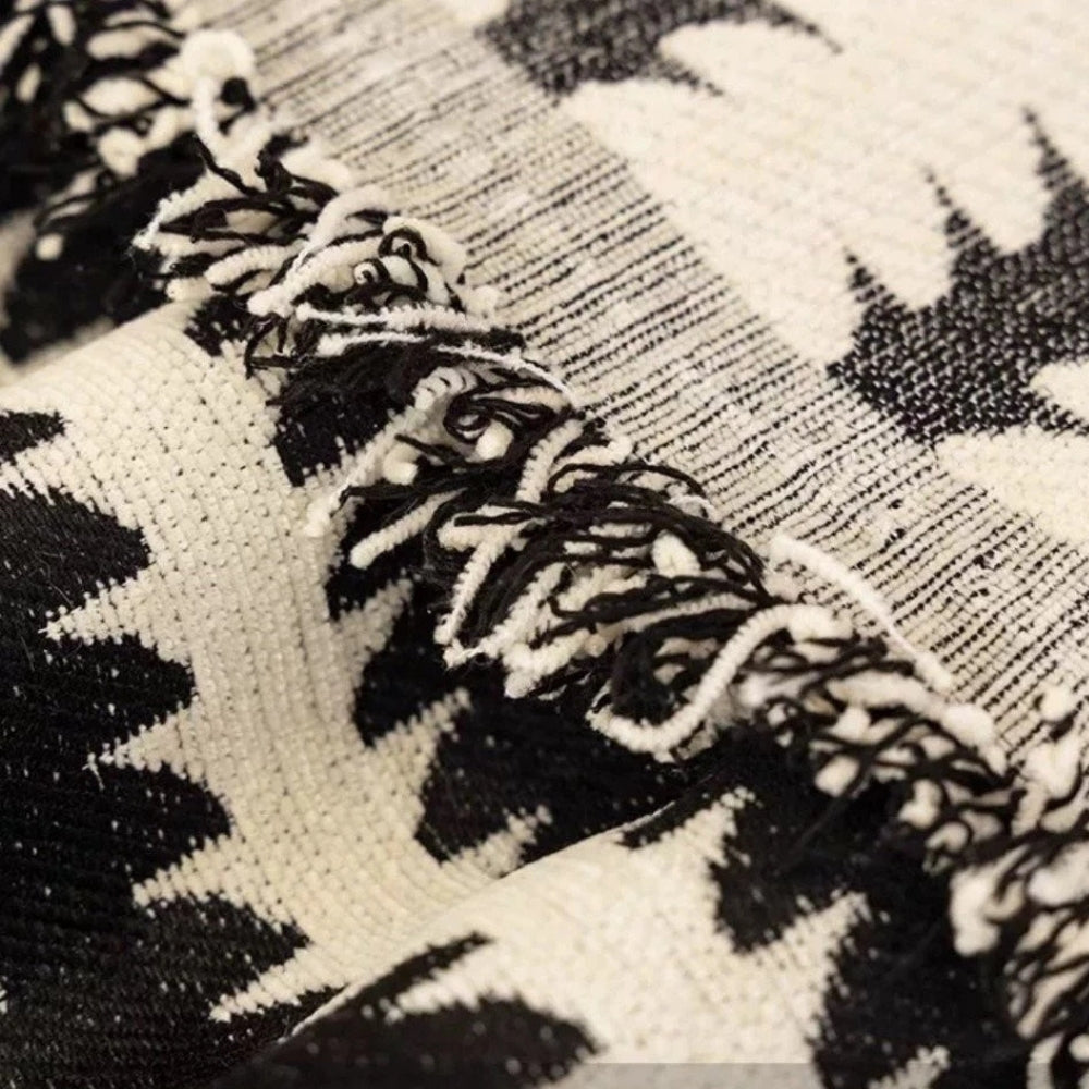 Decoratieve gecapitonneerde bankplaid met gezellige textuur