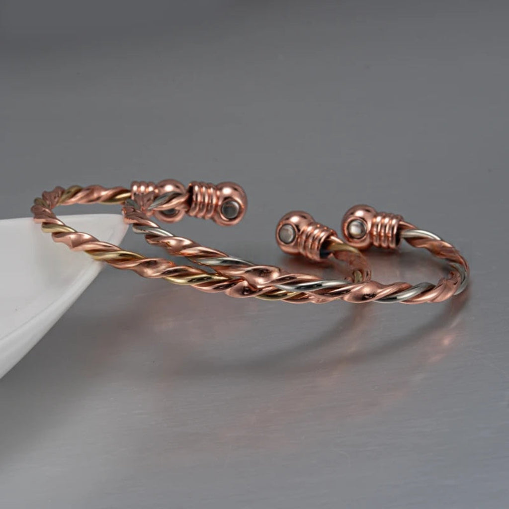 Magnetic Therapy Bracelet With A Red Copper-colored Twisted Rope Design