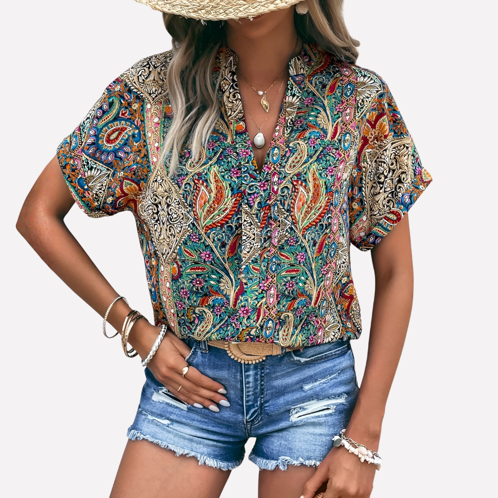 Casual damesblouse met V-hals, paisleyprint en verlaagde schouders.