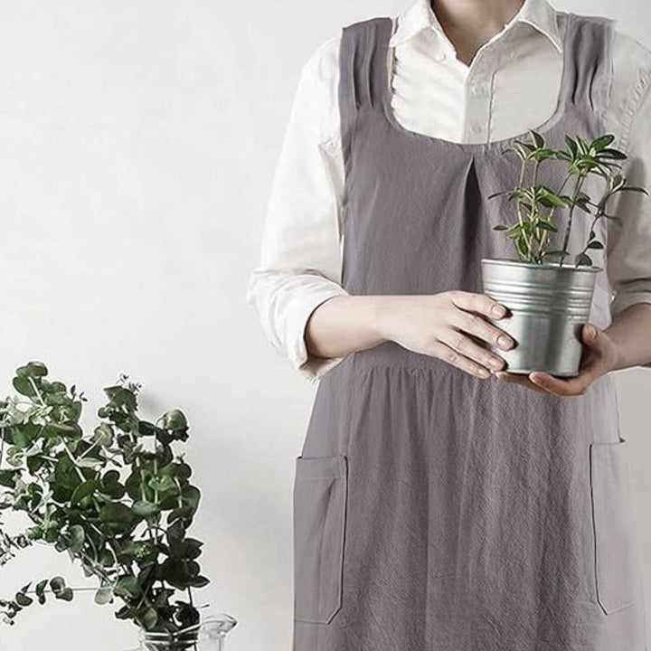 Minimalistische schortjurk met comfortabele gekruiste rug en zakken
