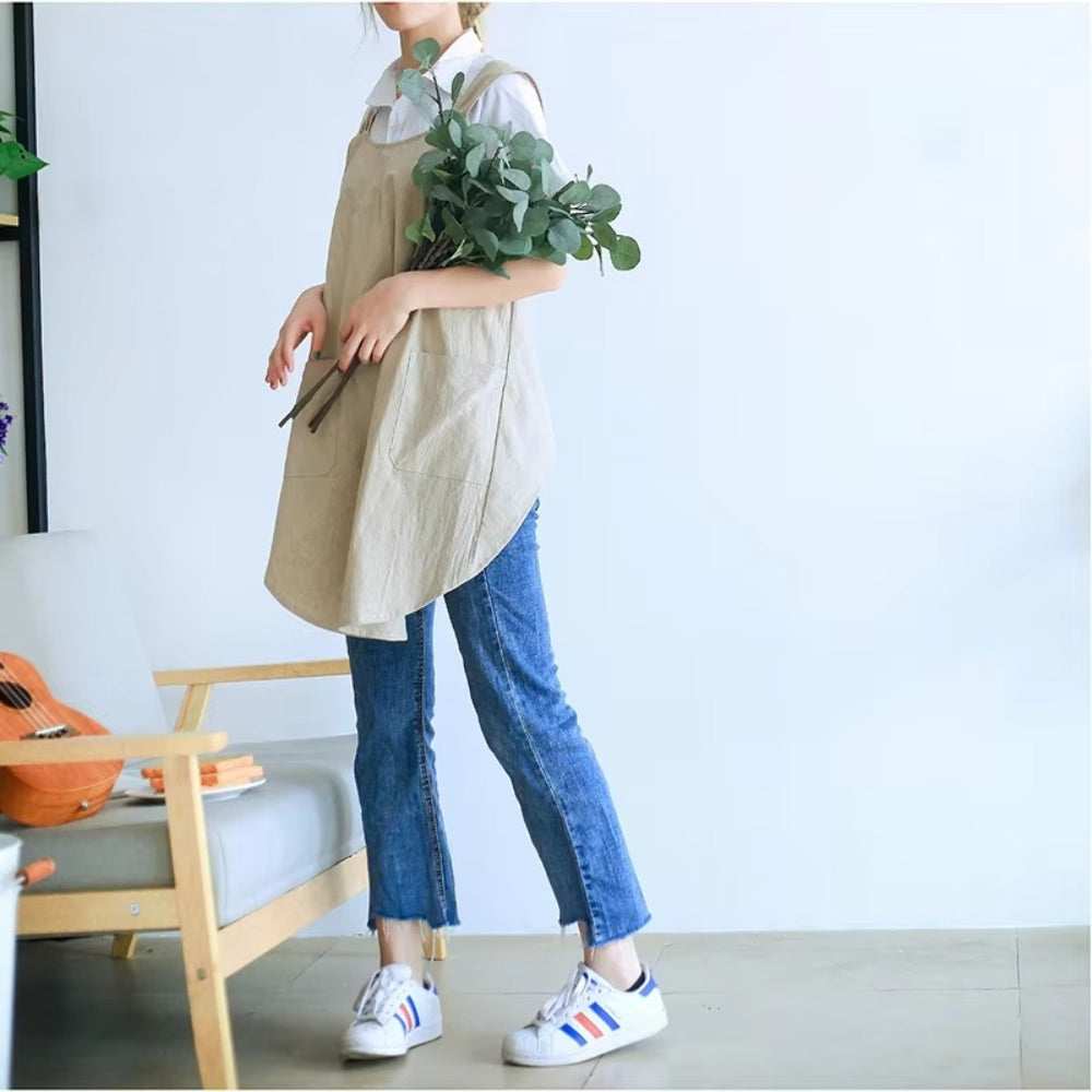 Minimalistische schortjurk met comfortabele gekruiste rug en zakken