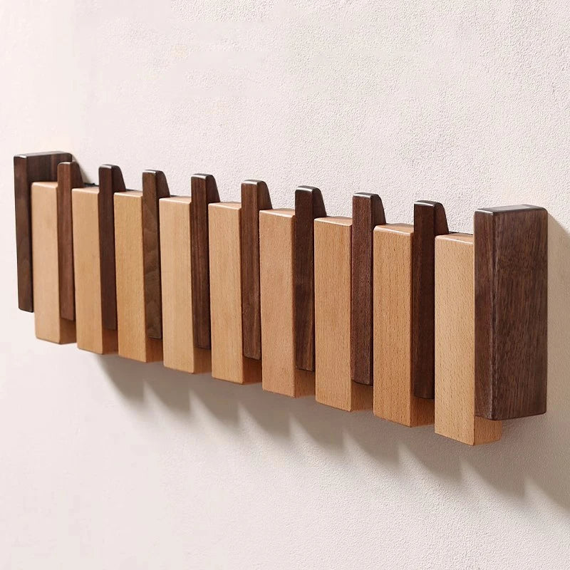 Pianostijl wandkapstok met opklapbare haken