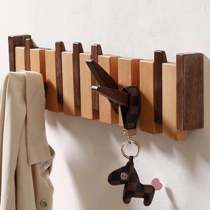 Pianostijl wandkapstok met opklapbare haken