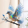 Raamdecoratie met blauwe vogel om op te hangen als zonnevanger