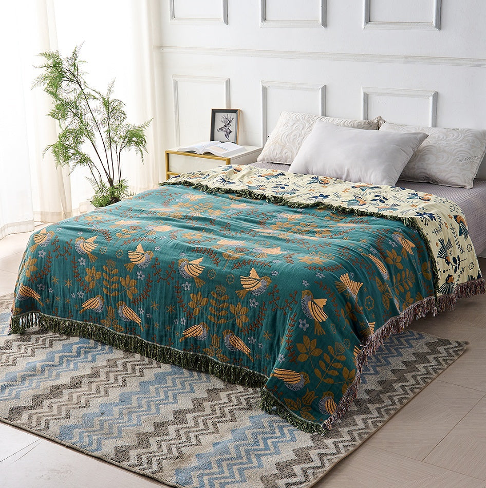 Elegante omkeerbare decoratieve deken in petrol & crème