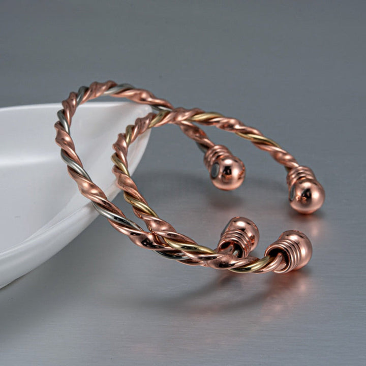 Magnetic Therapy Bracelet With A Red Copper-colored Twisted Rope Design