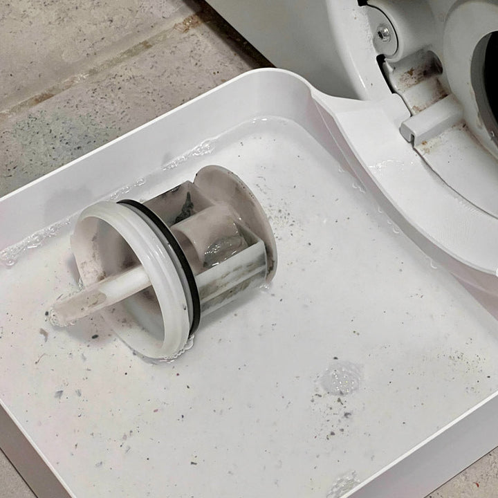 Afvoerbak voor wasmachine om water op te vangen