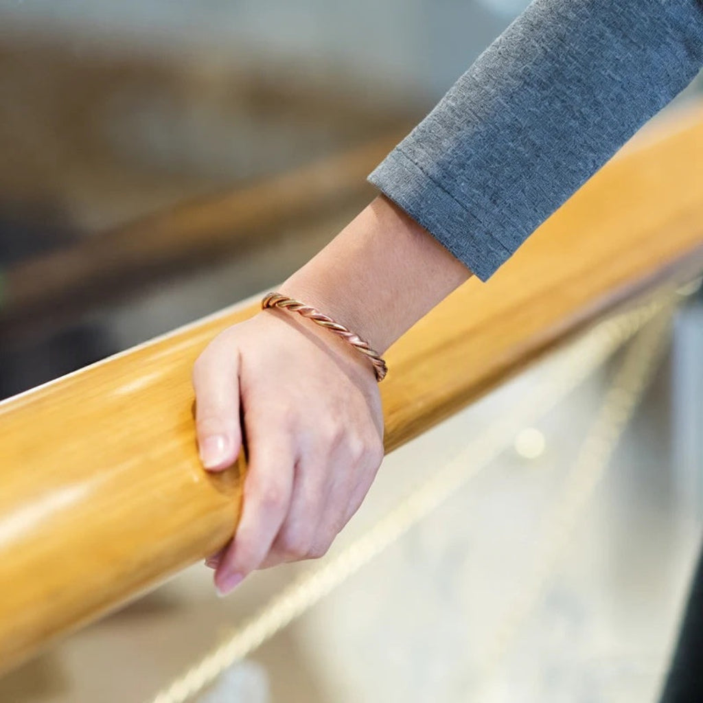 Magnetic Therapy Bracelet With A Red Copper-colored Twisted Rope Design