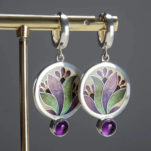 Elegante oorbellen van wit goud met paarse kristallen