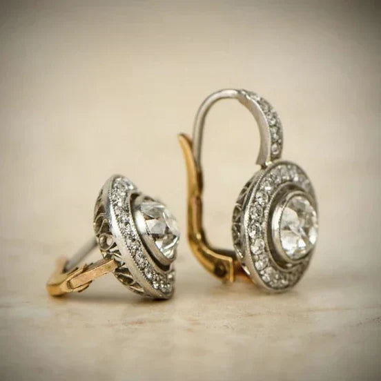Elegante zilveren oorbellen met zirkonia en gouden accenten