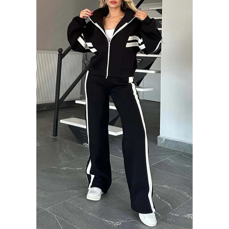 Vrijetijdsset voor dames met vest met rits en broek met wijde pijpen en contraststrepen